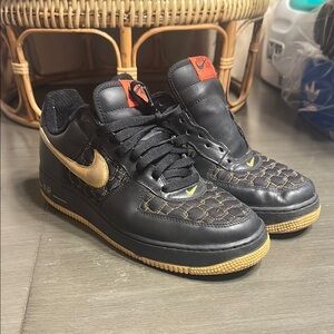 Black and Gold Nike Air Force 1 Sneakers
